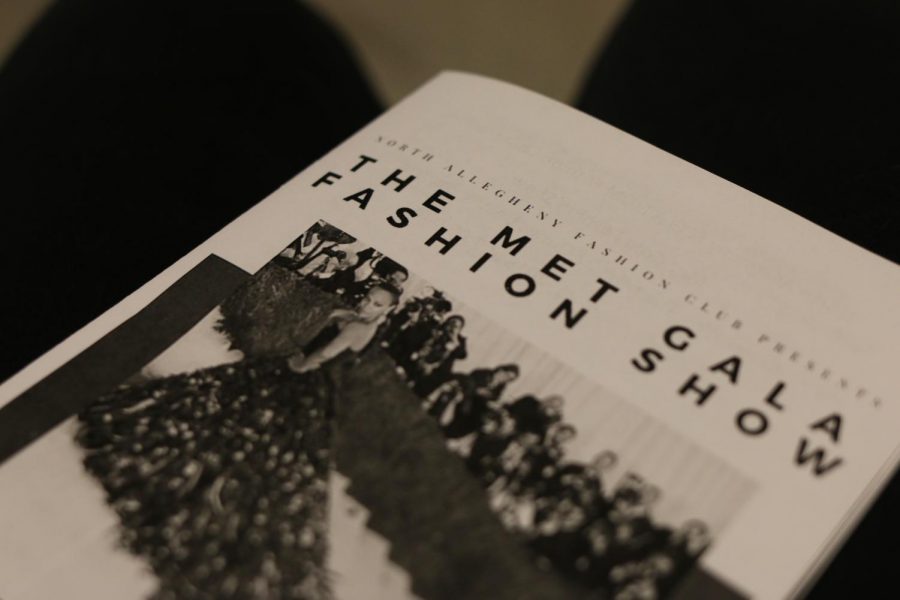 A photo of the program for the NA Met Gala Fashion Show