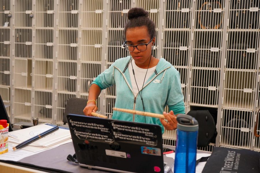 3:00 Snare captain Malia Wilson practices various cadences before the Friday night performance.
