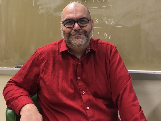 Mr. Solenday challenged his students to raise $400.  In return, he shaved his head.
