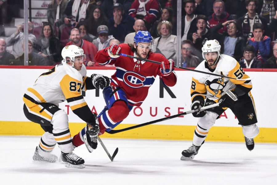 Montreals Jonathan Drouin fights off Pittsburghs Crosby and Letang last winter.  The two teams would later meet in the qualifying round of the playoffs, which would spell an early demise for the Penguins.