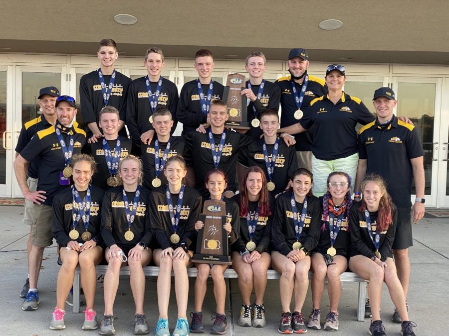 The Cross Country team with their medals and trophy after winning the state championship on Saturday, November 7th.