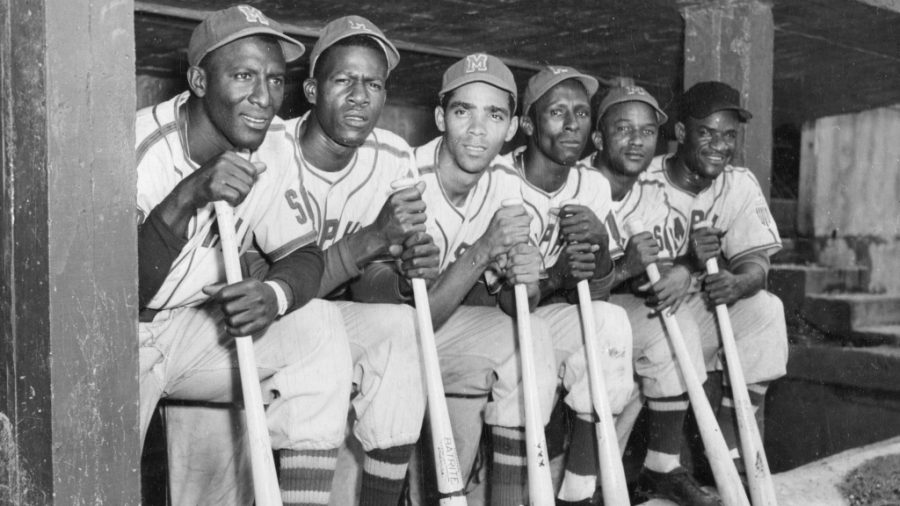 Photographic print by the Hook Brothers of a group of Cuban baseball players from the Negro League Red Sox in the dugout together during a home game, Memphis, Tennessee, circa 1951. Among the players are Carlos Colas, far left, and Pedro Formental, far right. (Photo by Transcendental Graphics/Getty Images)