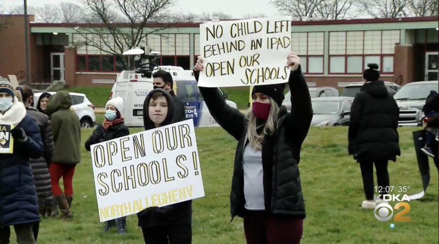 On Monday, over a dozen parents and students came together to protest the extension of remote learning.