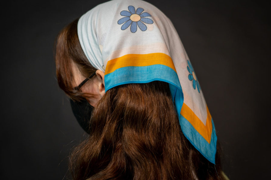 Michaela Golik styles her floral headscarf, a rising trend this 2021 spring season. 