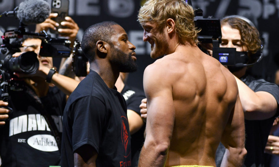 Floyd Mayweather, left, and Logan Paul pose for photographers during a weigh-in Saturday, June 5, 2021, in Hollywood, Fla. Paul is scheduled to fight Mayweather in an exhibition boxing match at Hard Rock Stadium in Miami Gardens, Fla., Sunday. (AP Photo/Jim Rassol) ORG XMIT: FLJS103