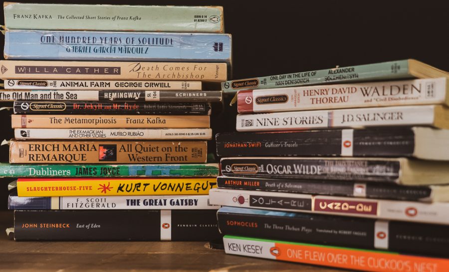 A stack of various classic literature books to depict the humanities resources provided to students but not utilized.