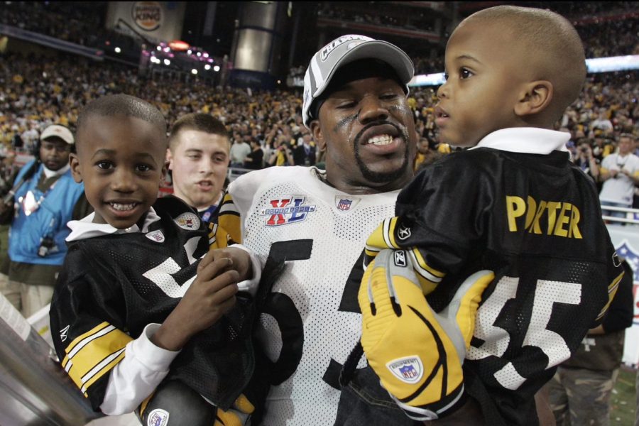Former Steeler Joey Porter, on the field at Super Bowl XL with his sons Joey, Jr. and Jacob, a current senior at NASH.