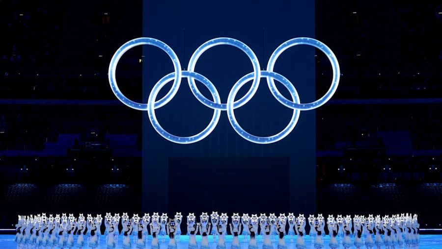 The young dancers holding snowflakes at the closing ceremony to celebrate the hard work of all the Olympians.
