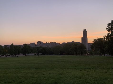 The sun setting over the Cathedral of Learning on Flagstaff Hill.