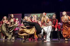 An action shot of the Tamburitzans group performing one of their dances. 