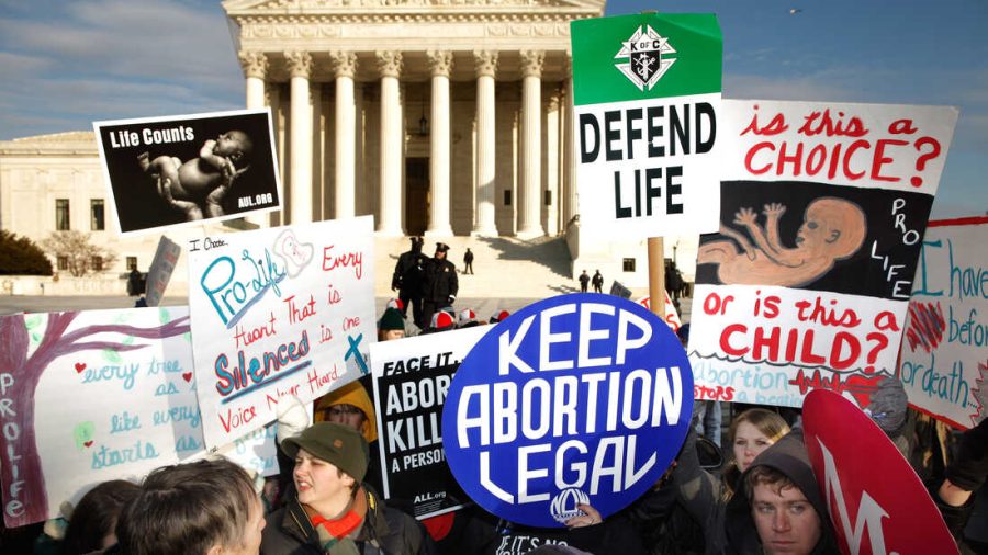 Demonstrators on both sides of the abortion debate protest in front of the Supreme Court. 