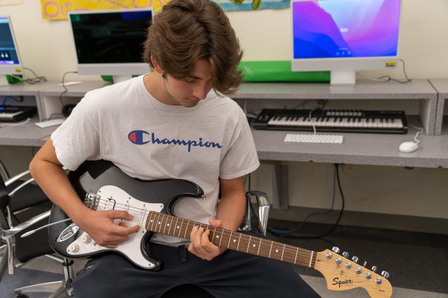 Bartholomew works on a song for Mr. Toziers AP Music class.