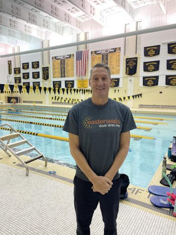 John Gallant on the pool deck bright and early, ready to start coaching.