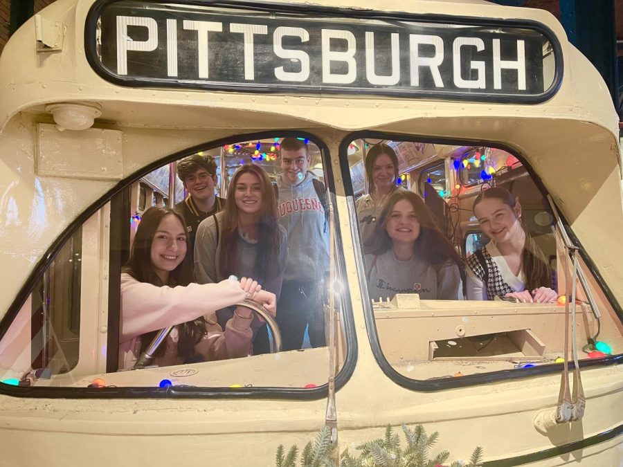 Ms. Greccos students board a replica of a Pittsburgh trolley.