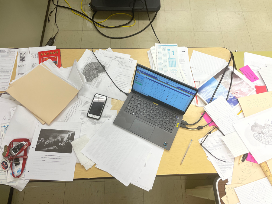 Mr. Maddixs desk could be described as organized chaos. 