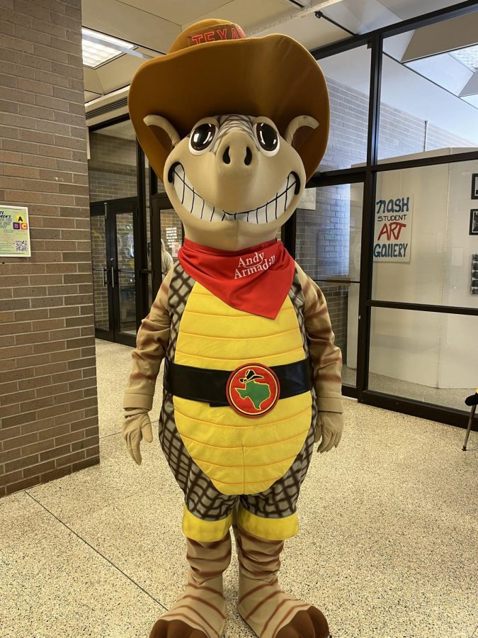 The elusive Andy the Armadillo flashes his mysterious smile as he stands in the NASH cafeteria last week during lunch periods.