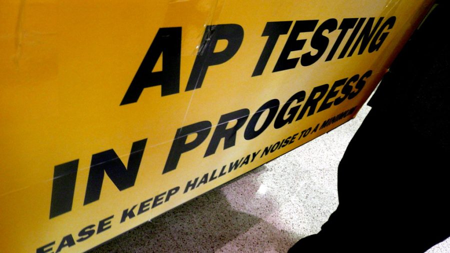 AP Testing In Progress sign, Neuqua Valley High, Chicago, IL.JPG by gruntzooki is licensed under CC BY-SA 2.0.