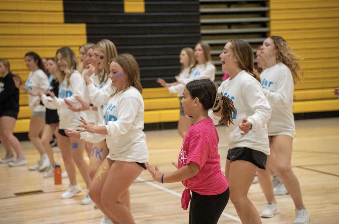 NASH students dance with elementary students at the 2022 TigerThon