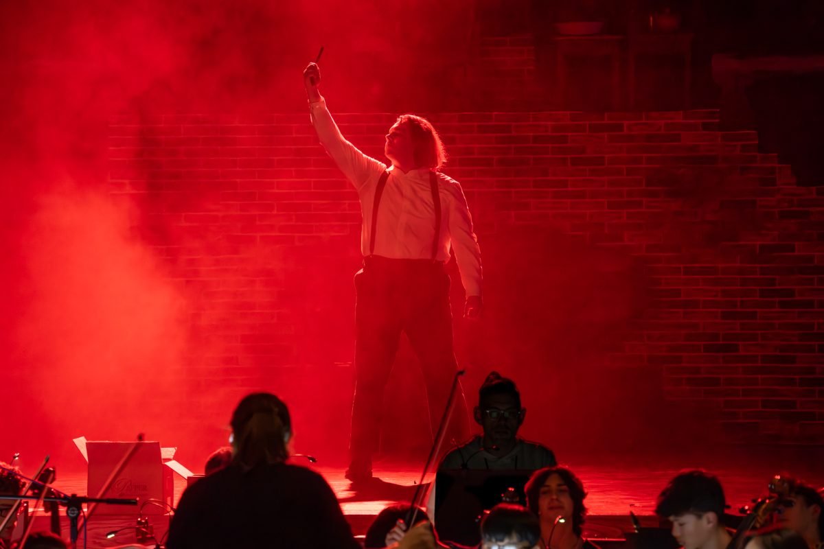 Sweeney Todd (Sam Lopuszynski) concludes The Ballad of Sweeney Todd in dramatic form on stage.