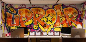 The graffiti art designed by art teacher Mr. Matthews in the NASH newsroom.