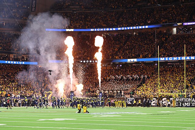 The Joint Armed Forces Color Guard, along with Soldiers from the United States Army Band “Pershing’s Own”, present the colors before the 2024 College Football Playoff National Championship Game at NRG Stadium in Houston, TX.