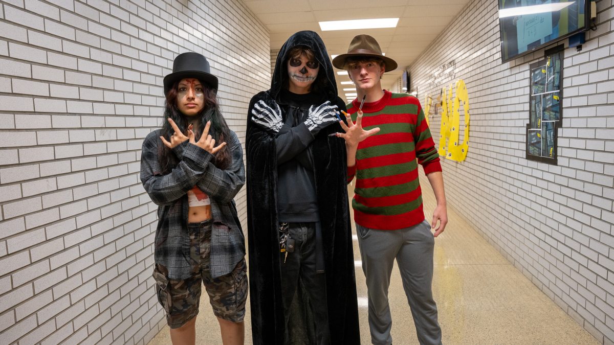 NASH seniors Maya Scott as Rob Zombie, Axel Standish as a skeleton, and Jackson Frazer as Freddy Kruger.