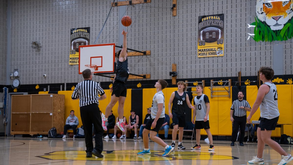 NASH senior Jack Ferraro (Team 14) goes up for a jump ball.