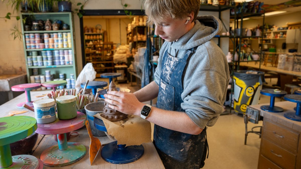 NASH senior Steven Smith in Pottery class.