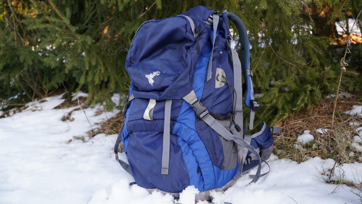 A hiking bag set in snow.