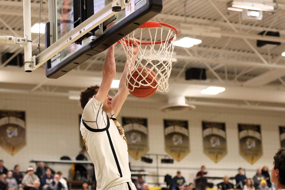 Peter Bratich dunks on Pine-Richland during the January match. NA went on to win, 41-36. (photo courtesy of Carol Manz/North Allegheny Sports Network)