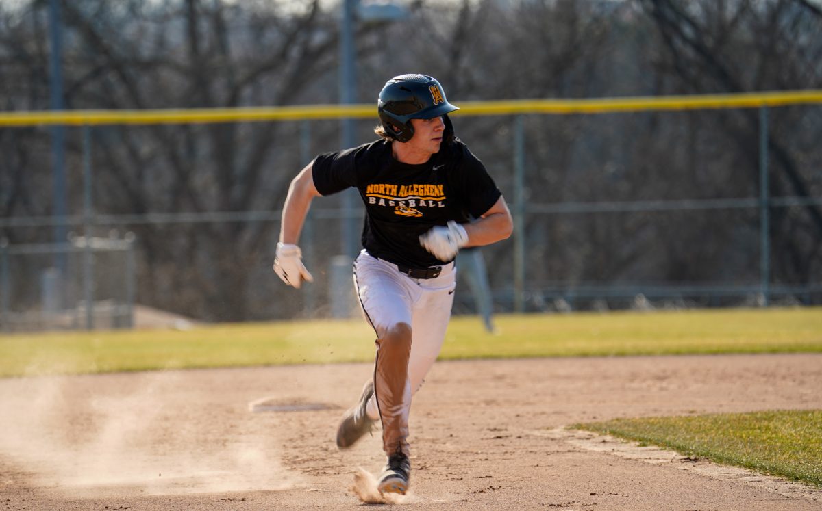 Senior Miles Pealer runs the bases during a scrimmage versus Central Valley last week.