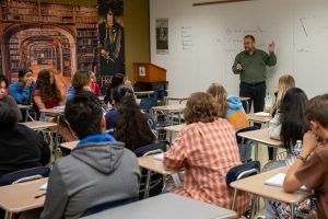 AP Lang teacher Mr. Rhinehart introduces his class to the argumentative writing skills during 2nd period.