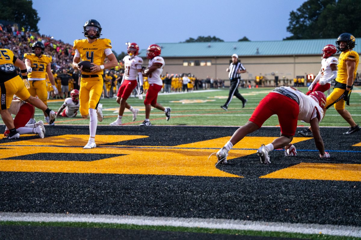 Quarterback Brady Brinkley scores a touchdown. The game featured a commanding performance by the Tigers, who won 35-0.