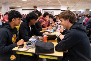 NASH juniors Sayjan Gupta, Anudeep Bandari, and Camden Jones enjoy 6th period lunch with friends.