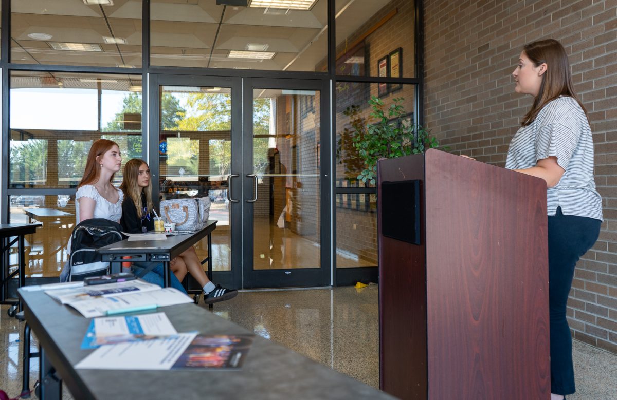 NASH juniors Lily Nelson and Ayden Scheer attend a lunchtime presentation by a representative from Pace University.  (photo: Juliet Forrest)