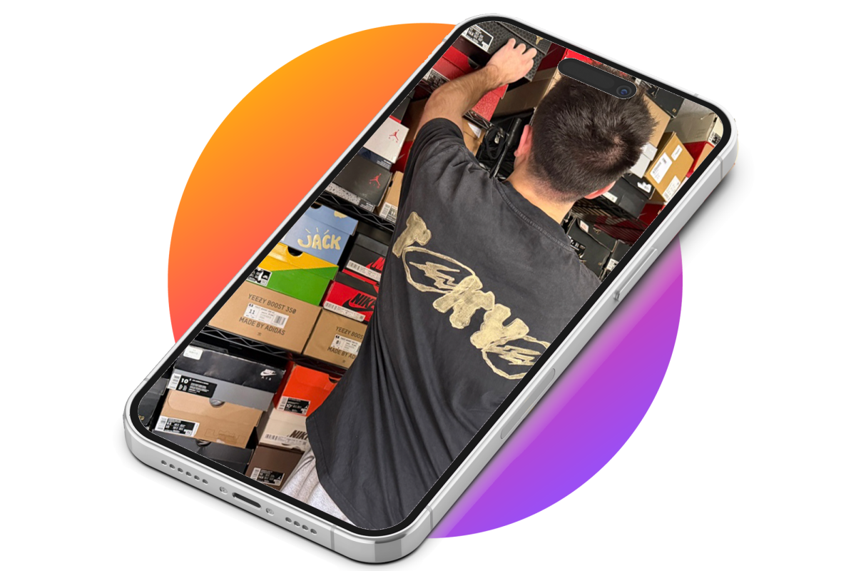 Nick Scheuring, NA '25, pulls a shoebox from his storage collection. (photo byt Samantha Siford, design by Elliot Davis)